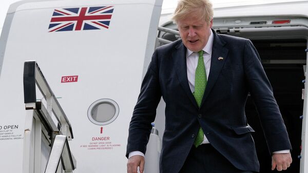 British Prime Minister Boris Johnson exits his plane upon his arrival at Stockholm's airport, Sweden, on May 11, 2022 - Sputnik International
