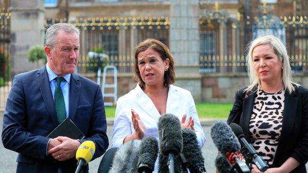 Sinn Fein's Conor Murphy, left, party leader Mary Lou McDonald, centre, and Michelle O'Neill speak to the media at Hillsborough Castle, Northern Ireland - Sputnik International