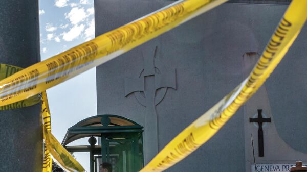 Crime scene tape is stretched across the exterior of the Geneva Presbyterian Church in Laguna Woods, Calif., Sunday, May 15, 2022, after a fatal shooting. - Sputnik International