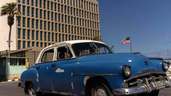 A classic American car drives past the United States Embassy, in Havana, Cuba, Thursday, March 3, 2022. - Sputnik International