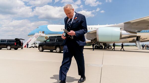 Senate Majority Leader Chuck Schumer of N.Y., steps off Air Force One at Andrews Air Force Base, Md., Tuesday, May 17, 2022, after traveling with President Joe Biden and first lady Jill Biden to pay respects and speak to families of the victims of Saturday's shooting at a supermarket in Buffalo, N.Y. - Sputnik International