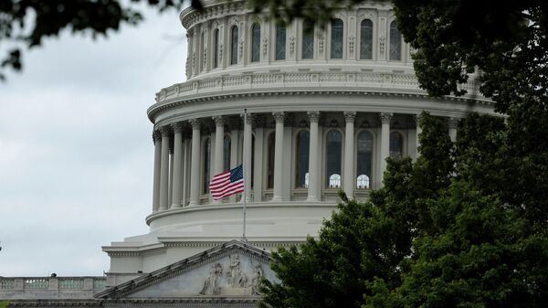The U.S. flag flies at half staff over the U.S. Capitol Building on May 12, 2022 in Washington, DC. - Sputnik International