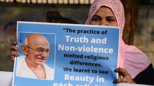 A protester holds a placard to demonstrate against the government's Citizenship Amendment Bill (CAB), on the occasion of the 72nd anniversary of Mahatma Gandhi's death, in Hyderabad on January 30, 2020. - Sputnik International