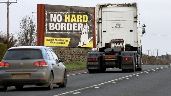 Traffic passes an No Hard Border anti-Brexit, pro-Irish unity billboard poster as it crosses the border road between Newry in Northern Ireland, on February 1, 2020, and Dundalk in Ireland - Sputnik International