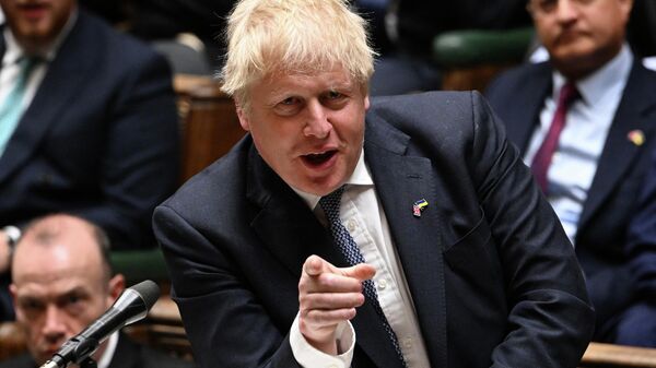 A handout photograph released by the UK Parliament shows Britain's Prime Minister Boris Johnson speaking during the first day of a debate on the Queen's Speech, in the House of Commons, in London, on May 10, 2022 - Sputnik International