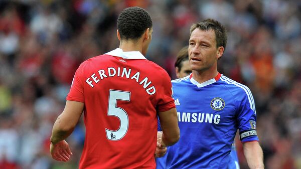 Chelsea's English defender John Terry (R) shakes hands with Manchester United's English defender Rio Ferdinand after losing 2-1 in the English Premier League football match between Manchester United and Chelsea at Old Trafford in Manchester, north west England, on May 8, 2011 - Sputnik International