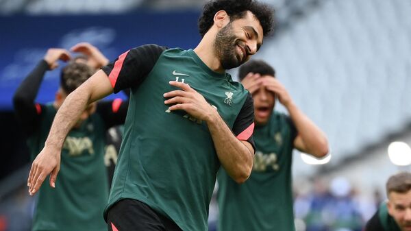 Liverpool's Egyptian midfielder Mohamed Salah reacts during a training session at the Stade de France stadium in Saint-Denis, Paris on May 27, 2022, on the eve of their UEFA Champions League final football match against Real Madrid. - Sputnik International