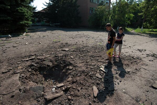The Ukrainian Army regularly shelled schools, killing parents, children, and teachers. The photo shows a shell crater in a school courtyard in Kramatorsk in July 2014. - Sputnik International