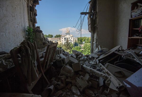 Donetsk, July 2014. This is not a military facility. This is one of the apartments in a block shelled by the Ukrainian Armed Forces. To be more exact, this is what is left of the apartment. There are tens of thousands of such houses in Donbass, all destroyed by the shelling. - Sputnik International