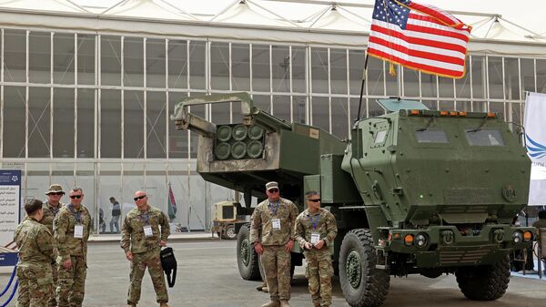 (FILES) In this file photo taken on March 06, 2022 US military personnel stand by a M142 High Mobility Artillery Rocket System (HIMARS) during Saudi Arabia’s first World Defense Show, north of the capital Riyadh. - - Sputnik International