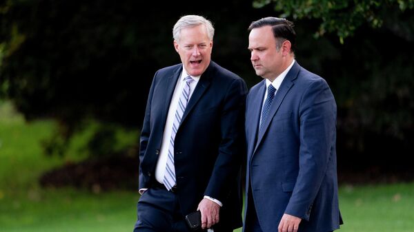 White House social media director Dan Scavino, right, and White House chief of staff Mark Meadows, left, walk to board Marine One with President Donald Trump on the South Lawn of the White House, Tuesday, Sept. 22, 2020, in Washington. - Sputnik International