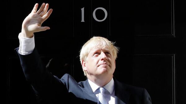 (FILES) In this file photo taken on July 24, 2019 Britain's new Prime Minister Boris Johnson gestures after giving a speech outside 10 Downing Street in London the day he was formally appointed British prime minister - Sputnik International