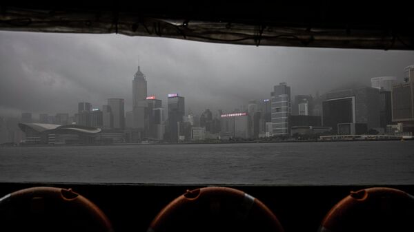 A general view of the city skyline as seen from a Star Ferry during a day of heavy rain in Hong Kong on June 8, 2022. - Sputnik International