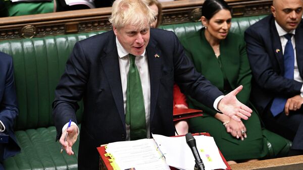 A handout photograph taken and released by the UK Parliament shows Britain's Prime Minister Boris Johnson attending the weekly Prime Minister's Questions (PMQs) session in the House of Commons, in London, on June 8, 2022 - Sputnik International