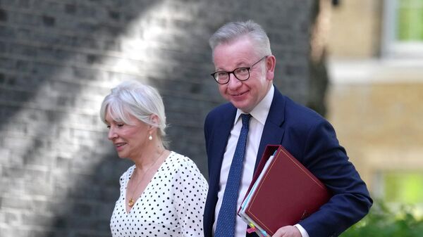 Britain's Secretary of State for Levelling Up, Housing and Communities Michael Gove, right, and Britain's Secretary of State for Digital, Culture, Media and Sport Nadine Dorries arrive for a cabinet meeting - Sputnik International