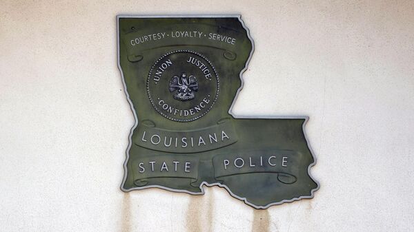A Louisiana State Police sign is seen outside Louisiana State Police Troop F headquarters in Monroe, La., on Aug. 4, 2021. The U.S. Justice Department is opening a “pattern-or-practice” investigation into the Louisiana State Police amid mounting evidence that the agency has looked the other way in the face of beatings of mostly Black men. Officials familiar with the matter told The Associated Press it will be announced later Thursday, June 9, 2022. - Sputnik International