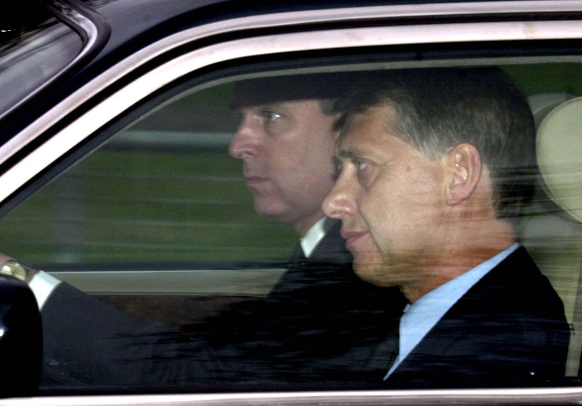 Prince Andrew at the wheel of his car next to a detective arrives at the Chapel Royal, Windsor Park, 31 March 2002 - Sputnik International, 1920, 20.06.2022