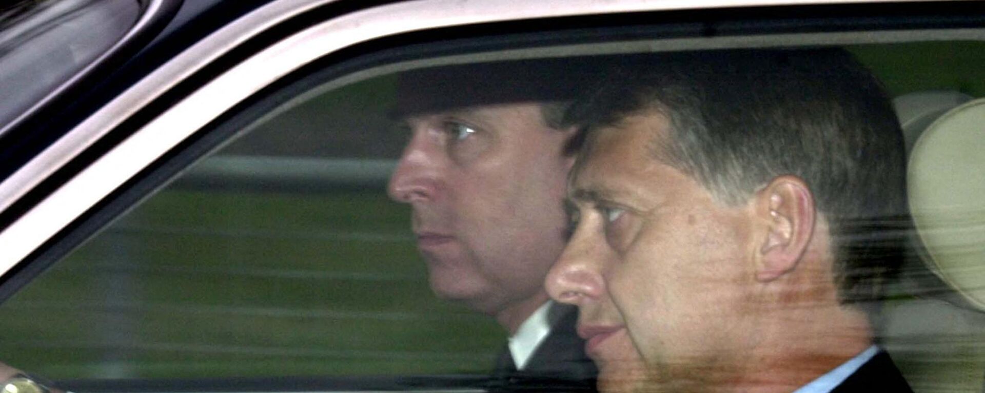 Prince Andrew at the wheel of his car next to a detective arrives at the Chapel Royal, Windsor Park, 31 March 2002 - Sputnik International, 1920, 10.06.2022