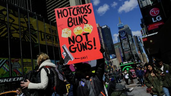 People go through Times Square after taking part in the March for Our Lives in New York on March 24, 2018. - Sputnik International