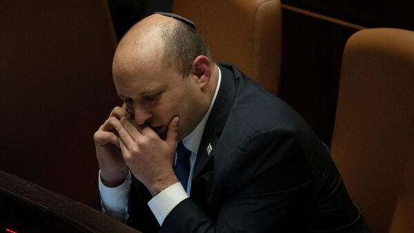 Israeli Prime Minister Naftali Bennett makes a call before voting on a law in the Knesset. File photo. - Sputnik International