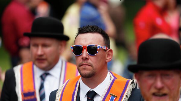 Members of the Orange Order and bands parade from Parliament Buildings, Stormont, in Belfast, Northern Ireland - Sputnik International