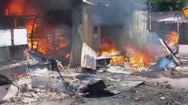 Aftermath of Ukrainian shelling of a market in Donetsk, 13 June 2022 - Sputnik International