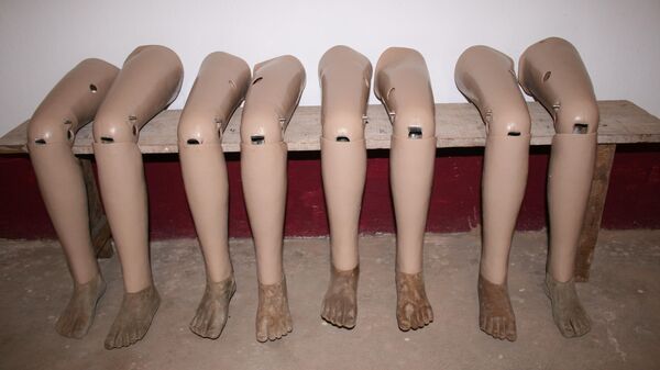 Prosthetic legs lined up for collection in Vientiane, Laos - Sputnik International