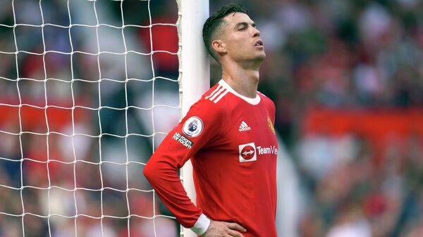 FILE- Manchester United's Cristiano Ronaldo rests against a goalpost during the English Premier League soccer match between Manchester United and Norwich City at Old Trafford stadium in Manchester, England, on April 16, 2022. - Sputnik International