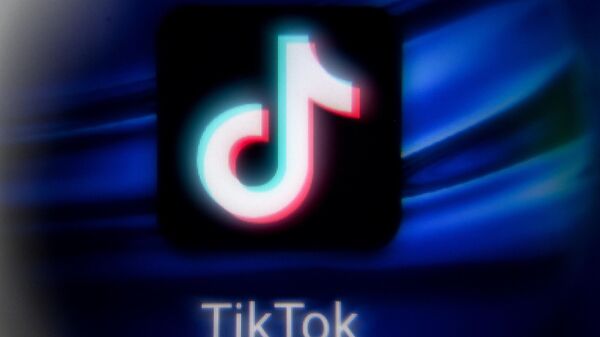 This picture taken in Moscow on November 11, 2021 shows the Chinese social networking service TikTok's logo on a tablet screen. - Sputnik International