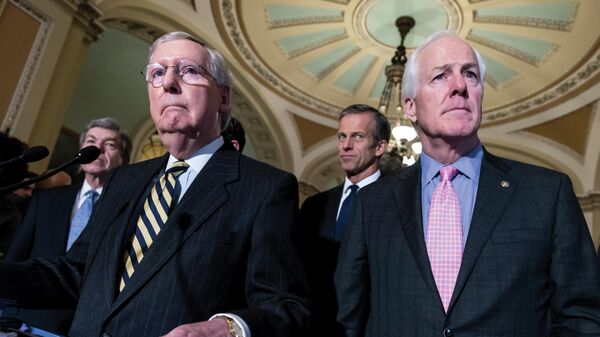 Sen. Mitch McConnell, R-Ky., left, and Sen. John Cornyn, R-Texas, right, talk to reporters following a closed-door policy meeting at the Capitol in Washington, Tuesday, March 8, 2016. In the aftermath of recent horrific mass shootings in Uvalde, Texas and Buffalo, New York, a bipartisan group of senators, including Cornyn and Sen. Chris Murphy, D-Conn., are holding private virtual meetings during recess to try to strike a compromise over gun safety legislation.  - Sputnik International