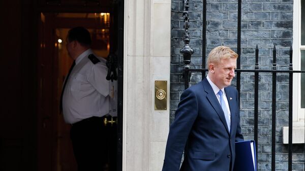 Britain's Conservative party chairman Oliver Dowden leaves after attending the weekly Cabinet meeting at 10 Downing Street, in London, on March 23, 2022. - Sputnik International