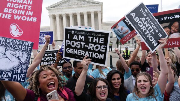 Demonstrators gather outside the Supreme Court in Washington, Friday, June 24, 2022. The Supreme Court has ended constitutional protections for abortion that had been in place nearly 50 years, a decision by its conservative majority to overturn the court's landmark abortion cases. (AP Photo/Jose Luis Magana) - Sputnik International