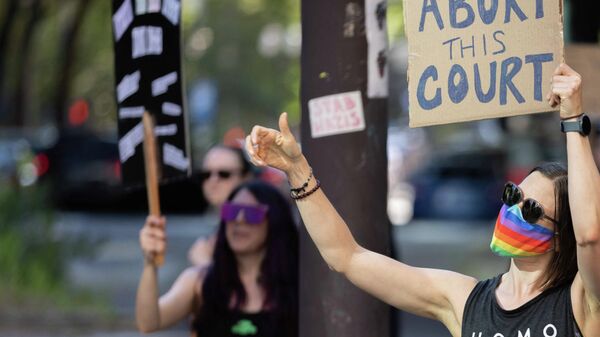 A sign reads Abort This Court as abortion rights activists protest after the US Supreme Court struck down Roe Vs. Wade, overturning the right to abortion, in Portland, Oregon, on June 24, 2022.  - Sputnik International