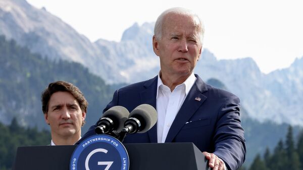 U.S. President Joe Biden speaks next to Canadian Prime Minister Justin Trudeau during the first day of the G7 leaders' summit at Bavaria's Schloss Elmau castle, near Garmisch-Partenkirchen, Germany, Sunday,  June 26, 2022.  - Sputnik International