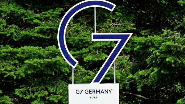 The G7 logo is reflected in a pool just outside the Elmau Castle, southern Germany, the venue of the 2022 G7 Summit, on June 26, 2022 - Sputnik International