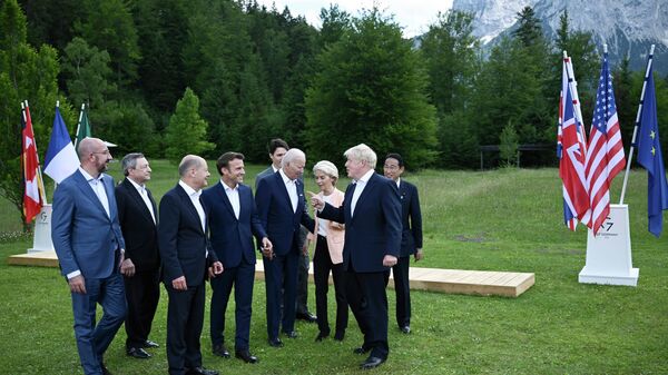 Britain's Prime Minister Boris Johnson, second right, speaks with from left,  European Council President Charles Michel, Italy's Prime Minister Mario Draghi, Germany's Chancellor Olaf Scholz, France's President Emmanuel Macron, US President Joe Biden, European Commission President Ursula von der Leyen and Canada's Prime Minister Justin Trudeau and Japan's Prime Minister Fumio Kishida as they leave after posing  for a group photo , during the G7 Summit, at Castle Elmau in Kruen, near Garmisch-Partenkirchen, Germany, Sunday, June 26, 2022 - Sputnik International