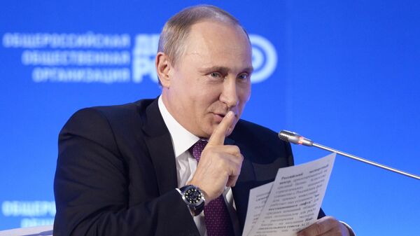 President of Russia Vladimir Putin giving the shhh gesture while attending a business forum. File photo. - Sputnik International