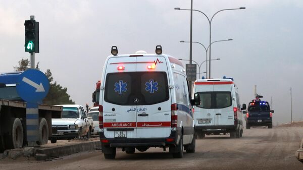 Ambulances leave the King Abdullah bin Al Hussein Training Center where a Jordanian policeman went on a shooting spree in Mwaqar on the outskirts of Amman, Jordan, Monday, Nov. 9, 2015. - Sputnik International