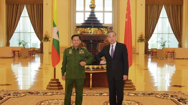 In this Jan. 12, 2021, file photo provided by Myanmar Military Information Team, Myanmar's Army Commander Senior Gen. Min Aung Hlaing, left, and Chinese Foreign Minister Wang Yi pose for a photo during their meeting in Naypyitaw, Myanmar. - Sputnik International