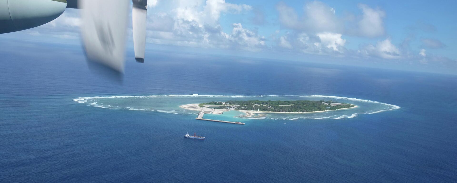 An aerial view shows a vessel preparing for a search-and-rescue exercise off Taiping island, in the South China Sea , Tuesday, Nov. 29, 2016, as part of efforts to cement its claim to a key island in the strategically vital waterbody - Sputnik International, 1920, 29.06.2022