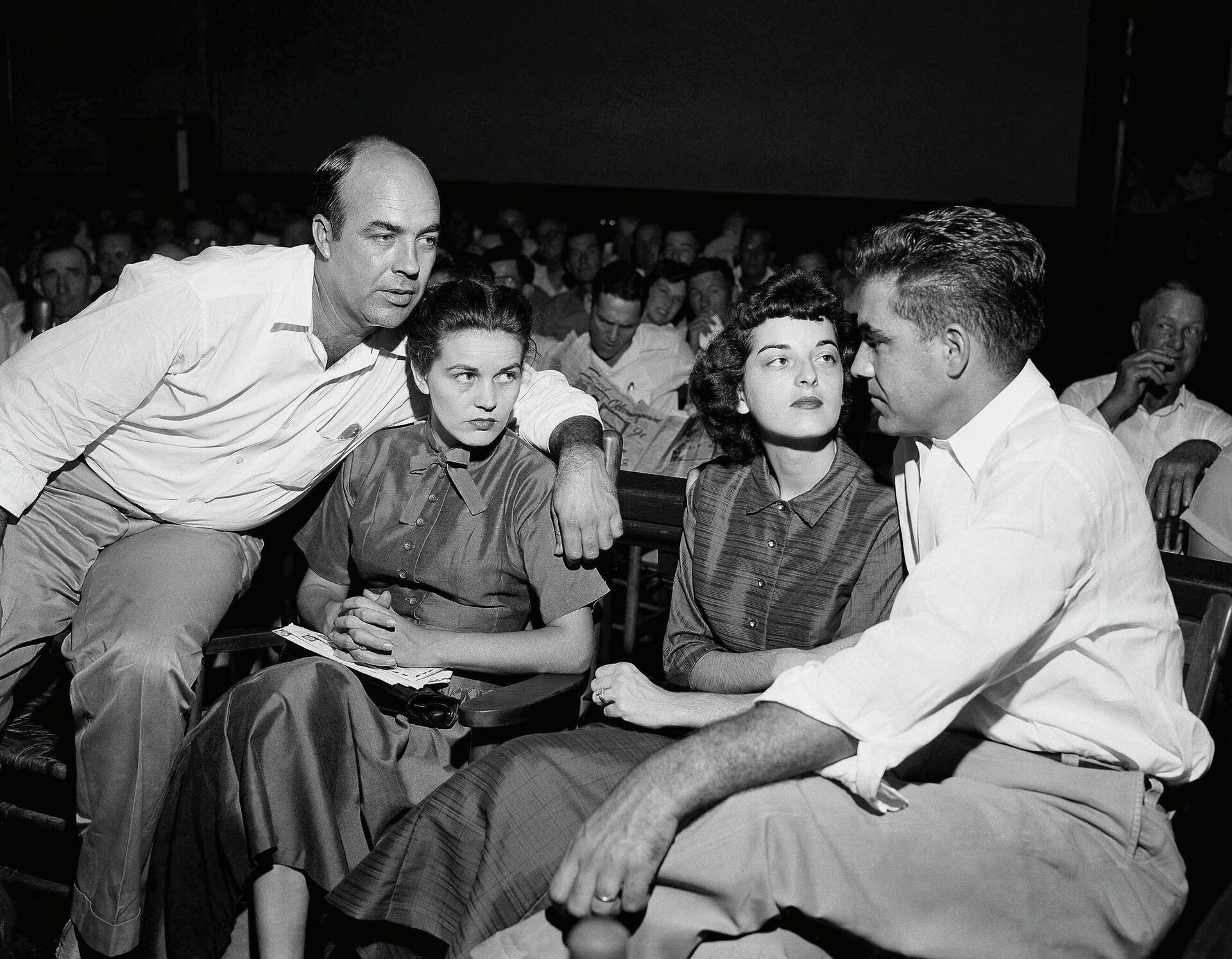 FILE - In this Sept. 23, 1955, file photo, J.W. Milam, left, his wife, second from left, Roy Bryant, far right, and his wife, Carolyn Bryant, sit together in a courtroom in Sumner, Miss. Bryant and his half-brother Milam were charged with murder but acquitted in the kidnapping and torture slaying of 14-year-old black teen Emmett Till in 1955 after he allegedly whistled at Carolyn Bryant. A team searching the basement of a Mississippi courthouse for evidence about the lynching of Black teenager Emmett Till has found the unserved warrant in June 2022 charging a white woman in his kidnapping in 1955, and relatives of the victim want authorities to finally arrest her nearly 70 years later.  - Sputnik International, 1920, 09.08.2022