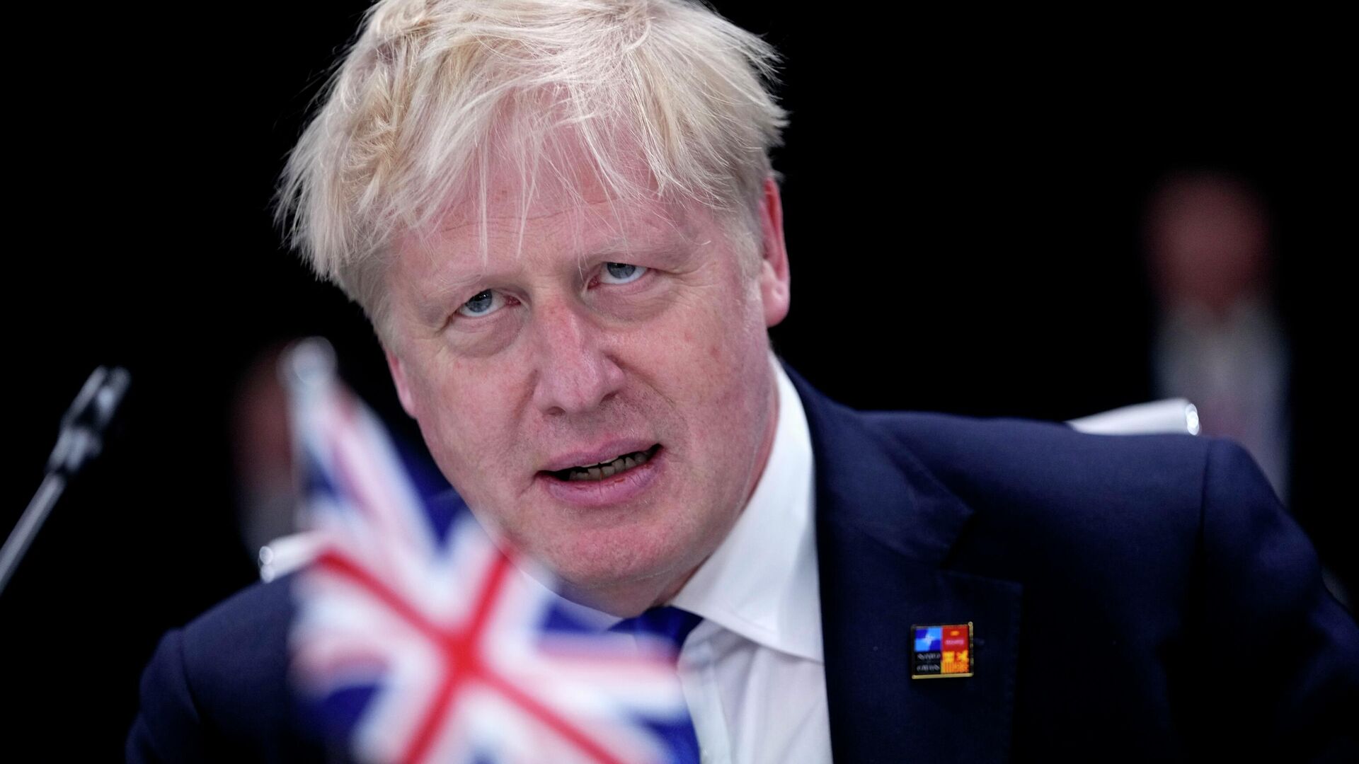 British Prime Minister Boris Johnson waits for the start of a round table meeting at a NATO summit in Madrid, Spain on Wednesday, June 29, 2022 - Sputnik International, 1920, 01.07.2022