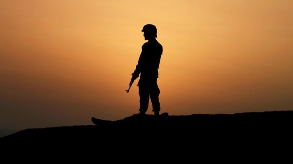 A Pakistan Navy soldier stands guard at a hilltop position near Gwadar port, about 700 kilometers (435 miles) west of Karachi. Pakistan, Monday, April 11, 2016. - Sputnik International