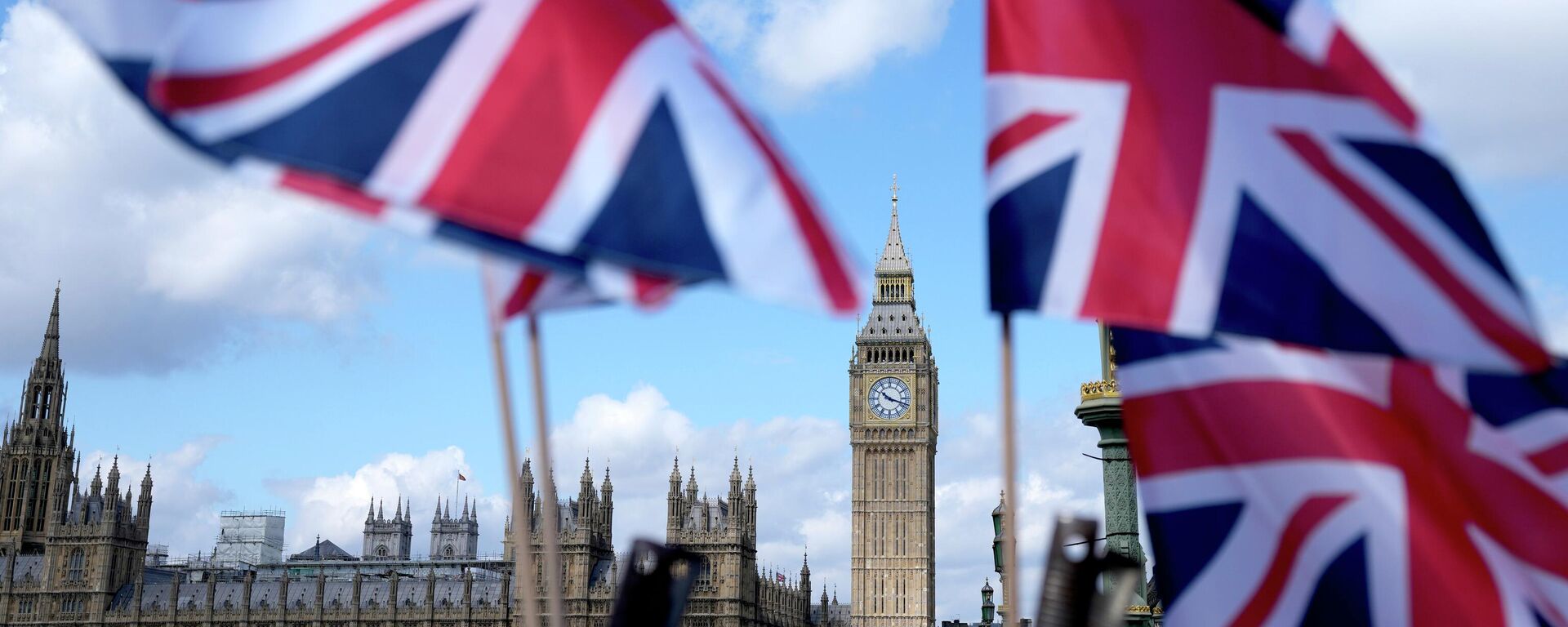 Union Jack flags are seen surrounding the Elizabeth Tower, known as Big Ben, beside the Houses of Parliament in London, Friday, June 24, 2022. - Sputnik International, 1920, 01.07.2022