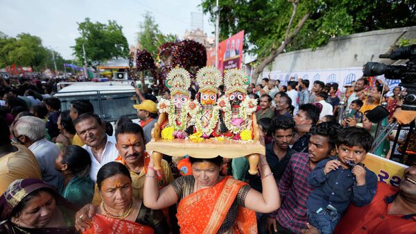 Devotees participate in an annual Rath Yatra, or Chariot procession of Lord Jagannath, in Ahmedabad, India, Friday, July 1, 2022. - Sputnik International