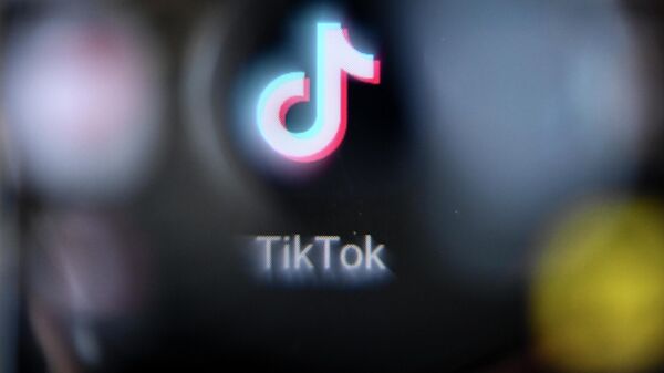 This picture taken in Moscow on October 12, 2021 shows the Chinese social networking service TikTok's logo on a smartphone screen. - Sputnik International