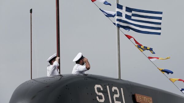 Greek Navy officers of Pipinos submarine salute as a Greek flag is raised  during a launch ceremony at Skaramanga shipyards near Athens, Monday, Oct. 6, 2014. - Sputnik International