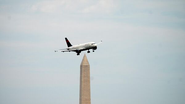 A Delta Airlines flight, with the Washington Monument in the background, approaches to land at Ronald Reagan Washington National Airport in Arlington, Virginia, on July 2, 2022 - Sputnik International