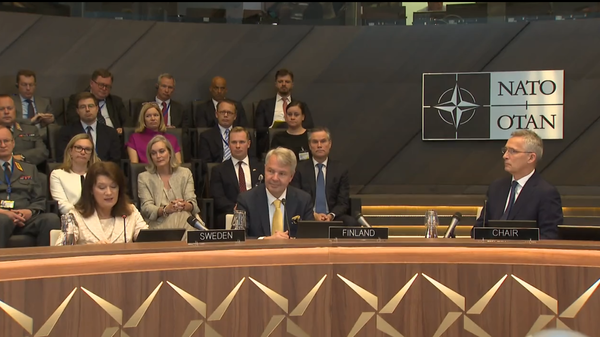 NATO Secretary General Jens Stoltenberg, the foreign ministers of Sweden and Finland, and ambassadors from NATO countries at signing ceremony on the signature of the accession protocols for the two Nordic nations. July 5, 2022. - Sputnik International