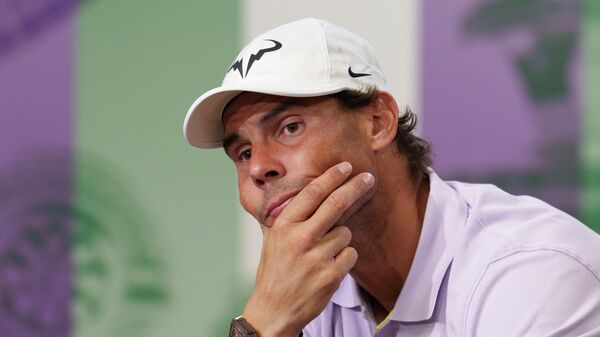 Spain's Rafael Nadal announces that he is withdrawing from the semi-final of the Gentlemen's Singles during a press conference at The All England Lawn Tennis Club, Wimbledon, Thursday, July 7, 2022. - Sputnik International
